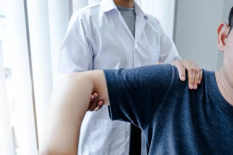 Shoulder pain treatment by a medical professional at Magnet Health NY, offering expert care at 907 E Tremont Ave and 741 E 233rd St, Bronx, NY