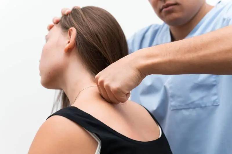 Healthcare professional offering neck pain care at Magnet Health NY, with treatment for spine and muscle issues at 907 E Tremont Ave, Bronx, NY 10460